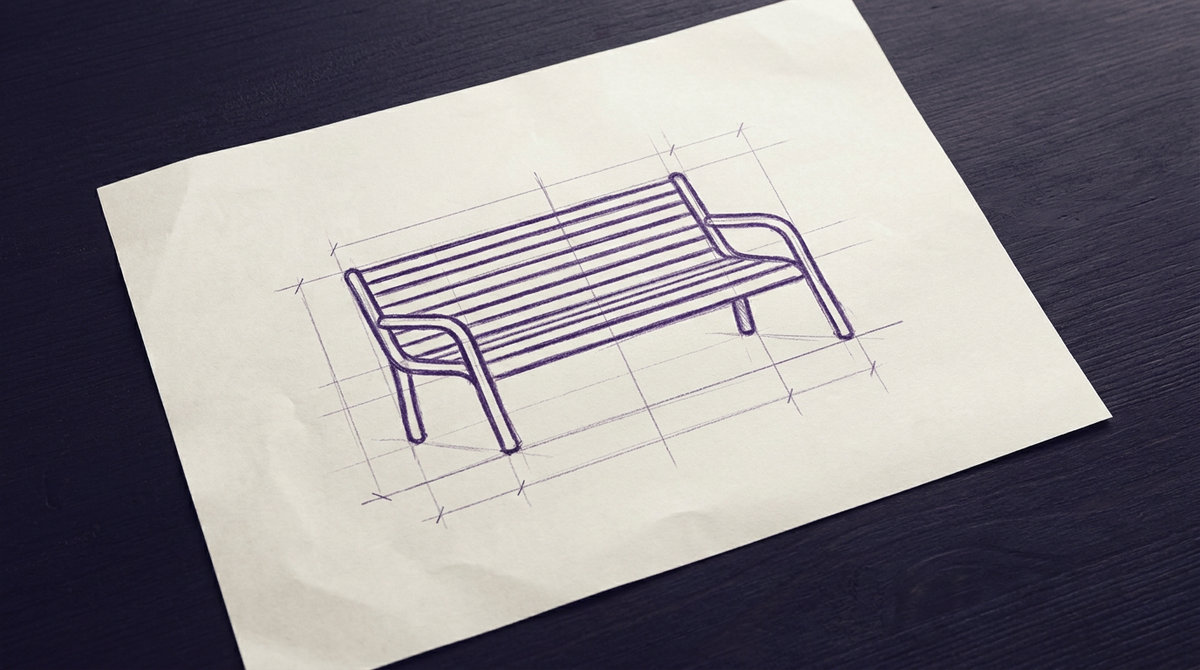 a slatted wooden park bench with curved metal armrests and legs