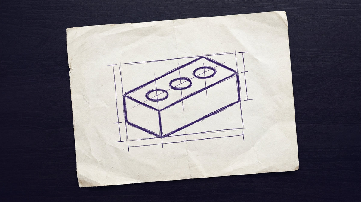 a rectangular clay construction brick with three cylindrical holes through its center