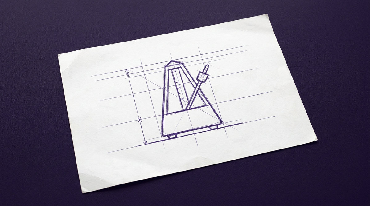 a mechanical metronome with a pyramidal body and an upright swinging pendulum rod fitted with an adjustable sliding weight