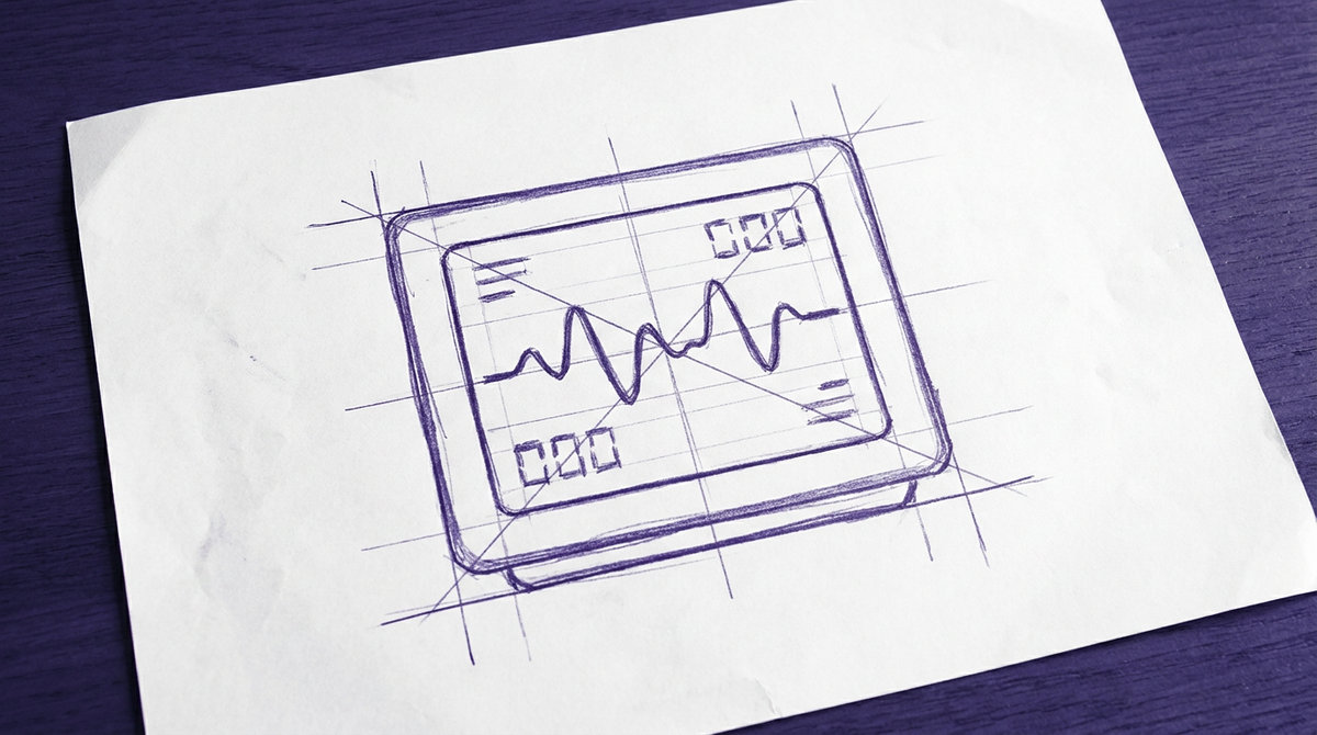 a rectangular bedside patient monitor with a flat display screen showing a continuous physiological waveform and digital numeric readouts
